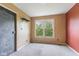 Bedroom with neutral carpet, a window, and a shelf, painted in complementary colors at 12449 Huntington Dr, Indianapolis, IN 46229
