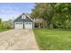 Charming two-story home with a well-manicured lawn and two-car garage at 12449 Huntington Dr, Indianapolis, IN 46229