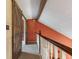 Hallway with wood railing and sliding barn door detail at 12449 Huntington Dr, Indianapolis, IN 46229