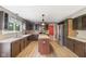 Modern kitchen featuring stainless steel appliances, an island, and custom cabinetry at 12449 Huntington Dr, Indianapolis, IN 46229