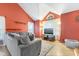 Bright living room with vaulted ceiling, large windows, and comfortable seating at 12449 Huntington Dr, Indianapolis, IN 46229