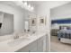 Modern bathroom featuring double sinks, quartz countertops, and sleek fixtures, offering a luxurious feel at 1285 Chatham Hills Blvd, Westfield, IN 46074