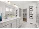 Elegant bathroom featuring a double vanity, marble floors, and a spacious glass-enclosed shower, offering spa-like luxury at 1285 Chatham Hills Blvd, Westfield, IN 46074