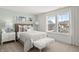 Serene bedroom with a wooden bed frame, plush bedding, and bright natural light at 1285 Chatham Hills Blvd, Westfield, IN 46074