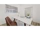 Well-lit home office featuring a stylish white desk, comfortable chair, and artistic wall decor, ideal for productivity at 1285 Chatham Hills Blvd, Westfield, IN 46074