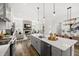 Bright kitchen with an island, stainless steel appliances, and an open layout connecting to the dining and living areas at 1285 Chatham Hills Blvd, Westfield, IN 46074