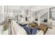 Open-concept living space showcasing modern design with adjacent kitchen and staircase at 1285 Chatham Hills Blvd, Westfield, IN 46074