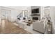 Elegant living room features a cozy fireplace, modern decor, and plenty of natural light at 1285 Chatham Hills Blvd, Westfield, IN 46074