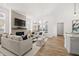 Bright living room with fireplace, large windows, and stylish furniture at 1285 Chatham Hills Blvd, Westfield, IN 46074