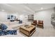 Basement living room with ping pong table, comfortable seating, and a custom accent wall at 1285 Chatham Hills Blvd, Westfield, IN 46074