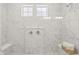 Modern shower features marble-style tile surround, dual shower heads, and a built-in bench at 1285 Chatham Hills Blvd, Westfield, IN 46074
