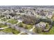 Aerial view showcases a neighborhood with well-maintained lawns and mature trees, offering a serene residential setting at 13855 Waterway Blvd, Fishers, IN 46040
