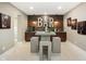 Basement featuring an at-home bar, custom lighting, and bar-top seating at 13855 Waterway Blvd, Fishers, IN 46040