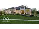 Beautiful single-Gathering home with manicured lawn, lush landscaping, and a stately exterior at 13855 Waterway Blvd, Fishers, IN 46040