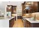 Modern kitchen boasts custom cabinets, stainless steel appliances, and a spacious island at 13855 Waterway Blvd, Fishers, IN 46040