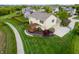 Aerial view of a house featuring a deck and manicured lawn at 14145 Charity Chase Cir, Carmel, IN 46074