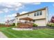 Well-maintained backyard with a wooden deck and lush green lawn at 14145 Charity Chase Cir, Carmel, IN 46074