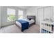 A well-lit bedroom with a bed and two windows at 14145 Charity Chase Cir, Carmel, IN 46074