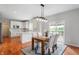 Open-concept dining room featuring sliding glass doors and a clear view of the kitchen at 14145 Charity Chase Cir, Carmel, IN 46074