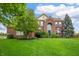Charming brick home with well-manicured lawn and mature trees creating great curb appeal at 14145 Charity Chase Cir, Carmel, IN 46074