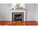Elegant fireplace featuring a decorative mantle, stone surround, and a hearth creating a focal point at 14145 Charity Chase Cir, Carmel, IN 46074
