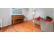 Cozy living room with hardwood floors, a piano, and comfortable seating at 14145 Charity Chase Cir, Carmel, IN 46074