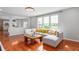 Spacious living room filled with natural light, featuring hardwood floors and comfortable seating at 14145 Charity Chase Cir, Carmel, IN 46074