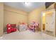 Fun playroom with play kitchen and dollhouse, perfect for  at 14145 Charity Chase Cir, Carmel, IN 46074