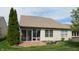 A well-maintained backyard featuring a stamped concrete patio and lush green grass at 1435 Colony Park Dr, Greenwood, IN 46143
