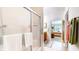 Bathroom featuring a glass shower, tiled floors, and access to an adjoining bedroom at 1435 Colony Park Dr, Greenwood, IN 46143