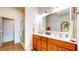 Well-lit bathroom with double vanity, ample counter space, and a glass-enclosed shower at 1435 Colony Park Dr, Greenwood, IN 46143