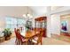 Elegant dining room with a large wooden table, chandelier, and a hutch for storage at 1435 Colony Park Dr, Greenwood, IN 46143