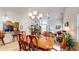 Open concept dining room flowing into the living area, filled with natural light at 1435 Colony Park Dr, Greenwood, IN 46143