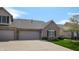 Charming exterior featuring a brick facade, an attached two-car garage, and a well-kept lawn at 1435 Colony Park Dr, Greenwood, IN 46143