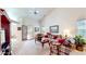 Spacious living room with vaulted ceilings, neutral carpet, and sliding glass doors to the outside at 1435 Colony Park Dr, Greenwood, IN 46143