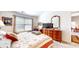 Main bedroom with a large window, dresser, and ensuite bathroom access, creating a relaxing space at 1435 Colony Park Dr, Greenwood, IN 46143