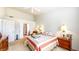 Comfortable main bedroom with neutral carpet, natural light, and access to the ensuite bathroom at 1435 Colony Park Dr, Greenwood, IN 46143