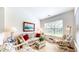 Bright sitting room with floral furniture, carpet floors, and natural light from the windows at 1435 Colony Park Dr, Greenwood, IN 46143