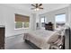 Bright bedroom with neutral decor, carpeted floor, and two windows that let in plenty of natural light at 1702 Alvord St, Indianapolis, IN 46202