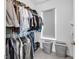 Organized walk-in closet with ample hanging space, shelving, and convenient storage solutions, enhanced by a window at 1702 Alvord St, Indianapolis, IN 46202
