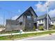Contemporary home with clean lines, neutral siding, and a professionally landscaped yard at 1702 Alvord St, Indianapolis, IN 46202
