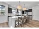 Modern kitchen showcasing a center island, stainless appliances, and stylish dark cabinetry at 1702 Alvord St, Indianapolis, IN 46202