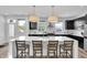 Modern kitchen with a large island, stainless steel appliances, and plenty of counter space for cooking enthusiasts at 1702 Alvord St, Indianapolis, IN 46202