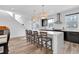 Bright kitchen area with a center island, stylish pendant lighting, and sleek black cabinetry, perfect for modern living at 1702 Alvord St, Indianapolis, IN 46202