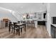 Open-concept kitchen and dining area with modern appliances, a large island, and ample seating for Gathering and guests at 1702 Alvord St, Indianapolis, IN 46202