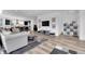 Stylish living area with hardwood floors, neutral colors, and open access to the kitchen at 1702 Alvord St, Indianapolis, IN 46202