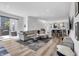 Bright open-concept living room with hardwood floors, modern decor, and natural light at 1702 Alvord St, Indianapolis, IN 46202