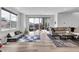 Spacious living room with hardwood floors, large windows, and contemporary furnishings at 1702 Alvord St, Indianapolis, IN 46202