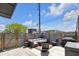 Private outdoor patio with modern seating, grill, and fenced-in perimeter, ideal for entertaining at 1702 Alvord St, Indianapolis, IN 46202
