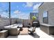 Cozy outdoor patio with comfortable seating, a grill, and a private fenced area at 1702 Alvord St, Indianapolis, IN 46202